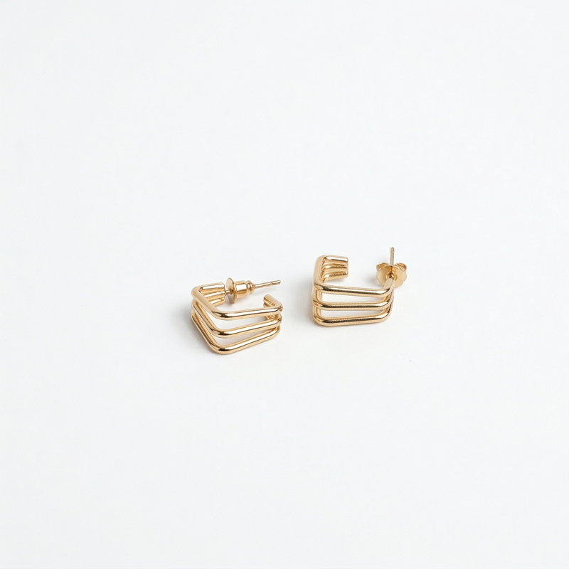 Golden Chevron Stud Earrings - Image 1